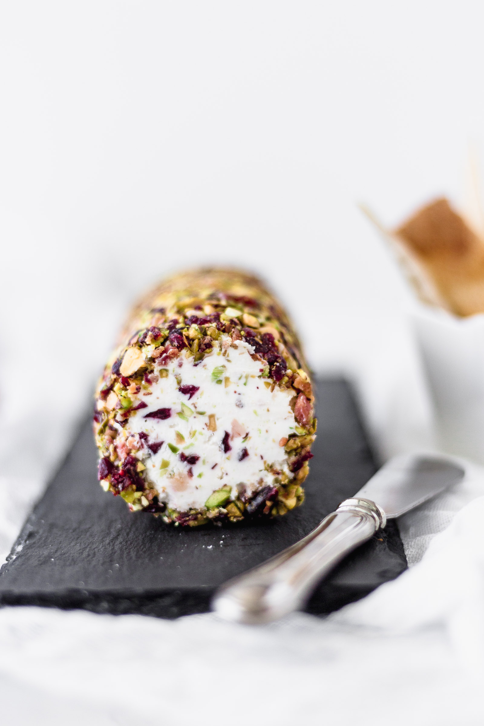 Cheese Log with Cranberries, Pistachios, Bacon and Honey